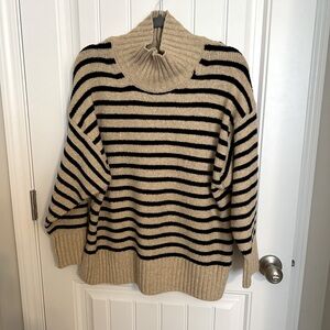 Cozy Black and Cream Striped Turtleneck Sweater